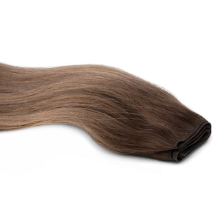 Luxurious Hairextensions Deluxe Double Weft Pro, 100% menselijk haar, lange haarextensies van 50 cm, zichtbaar in de afbeelding.