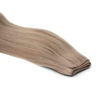 Luxueuze Luxurious Hairextensions Deluxe Triple Weft Pro, 100% menselijk haar, lange haarextensies van 50cm op een witte achtergrond.