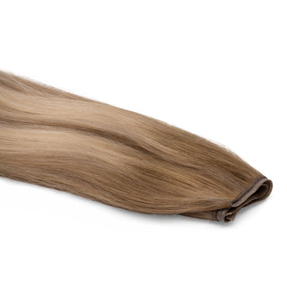Luxurious Hairextensions Deluxe Triple Weft Pro, 100% menselijk haar, lange haarextensies van 50 cm op de afbeelding.