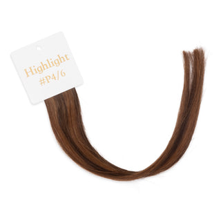 Luxurious-Hairextensions shade testers voor haarextensies, toont verschillende haarkleuren en texturen in close-up.