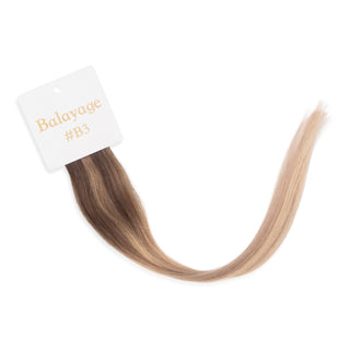 Luxurious-Hairextensions shade testers voor haarextensies in diverse kleuren, zichtbaar in close-up op afbeelding.