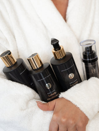 Luxurious Hairextensions Deluxe Serum Drops 50ml voor glanzend en verzorgd haar, getoond in de fles met pipet.